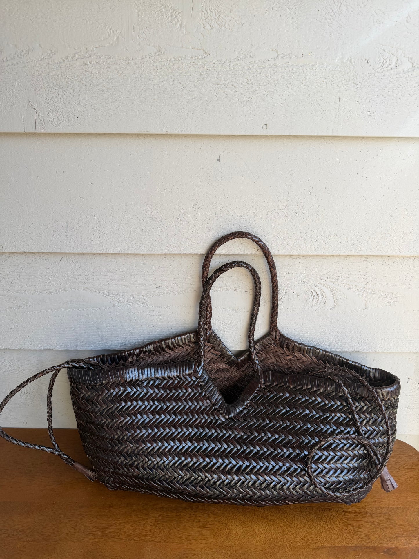 CASSIA handwoven leather bag styled outdoors in natural light