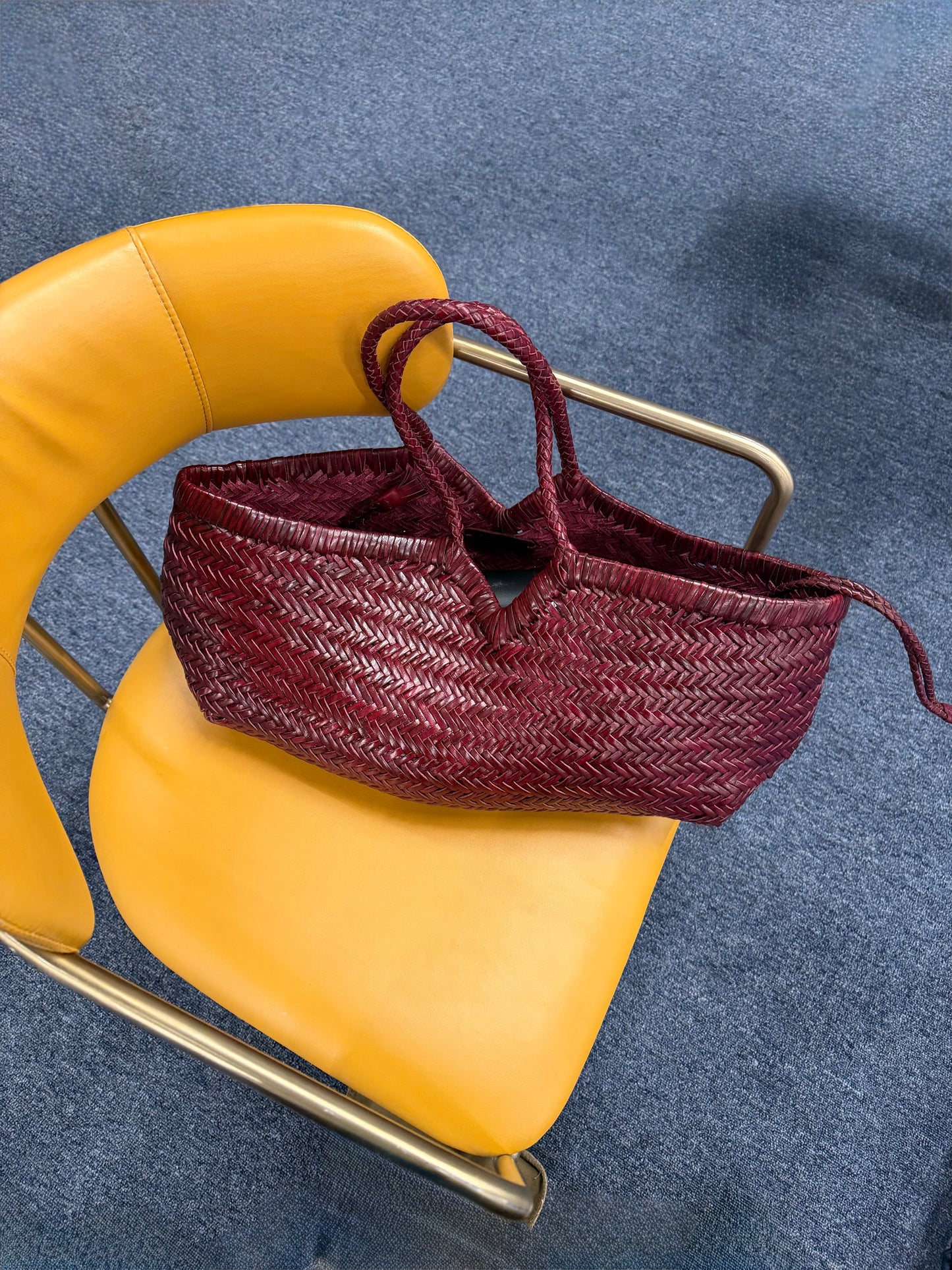 KAPSA handwoven leather bag styled indoors with soft sculptural shape
