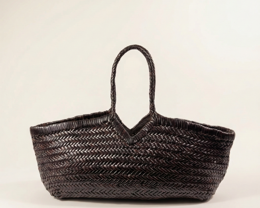 Brown woven handbag on a light beige background