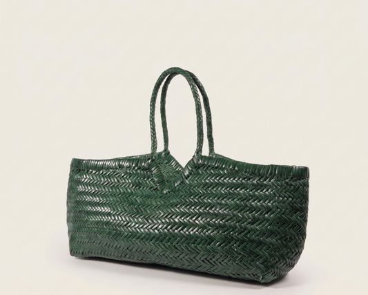 Green woven handbag on a light beige background