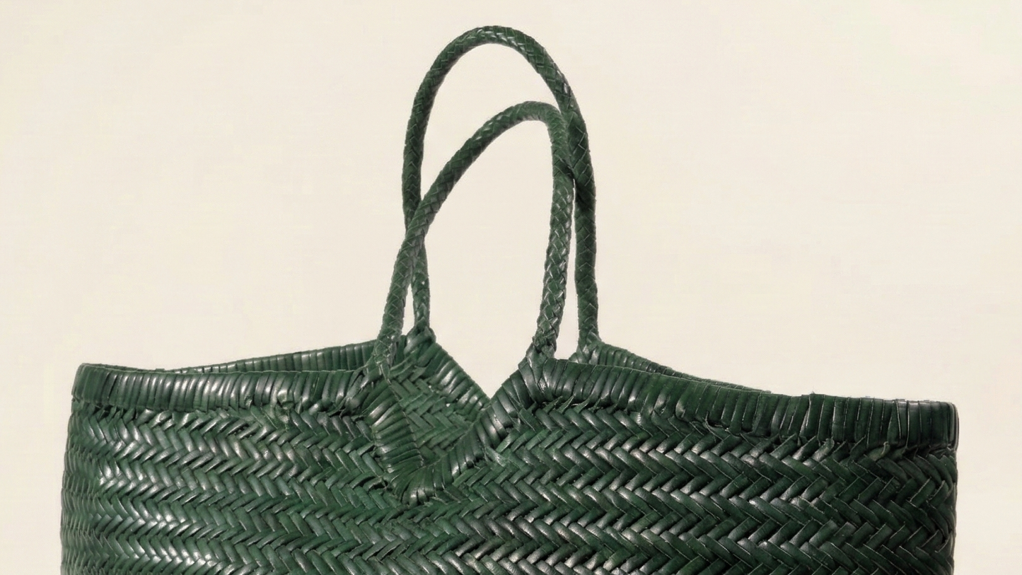 Close-up of the ELETTA full-grain leather weave and shoulder straps