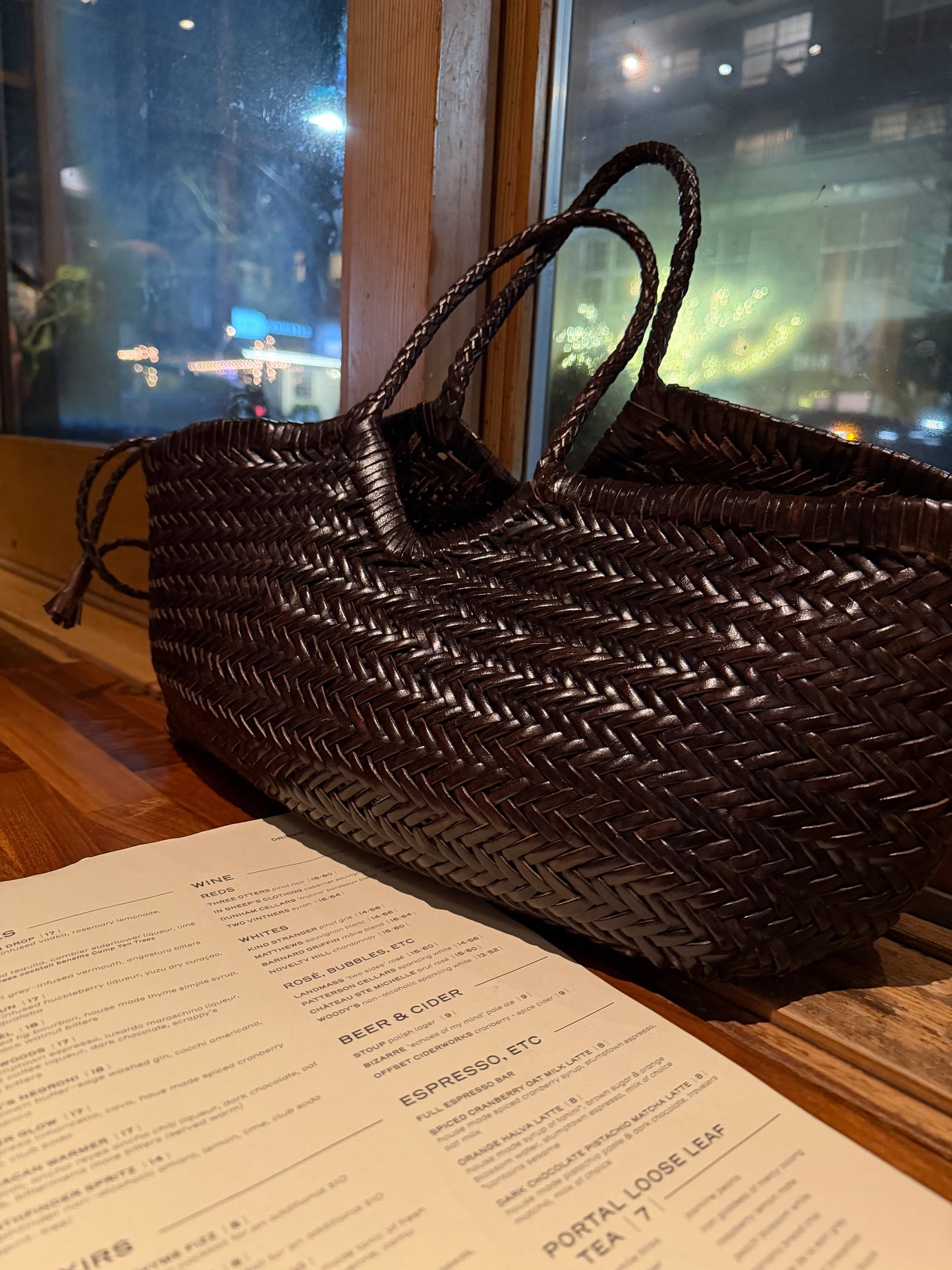CASSIA handwoven leather bag styled indoors with sculptural silhouette