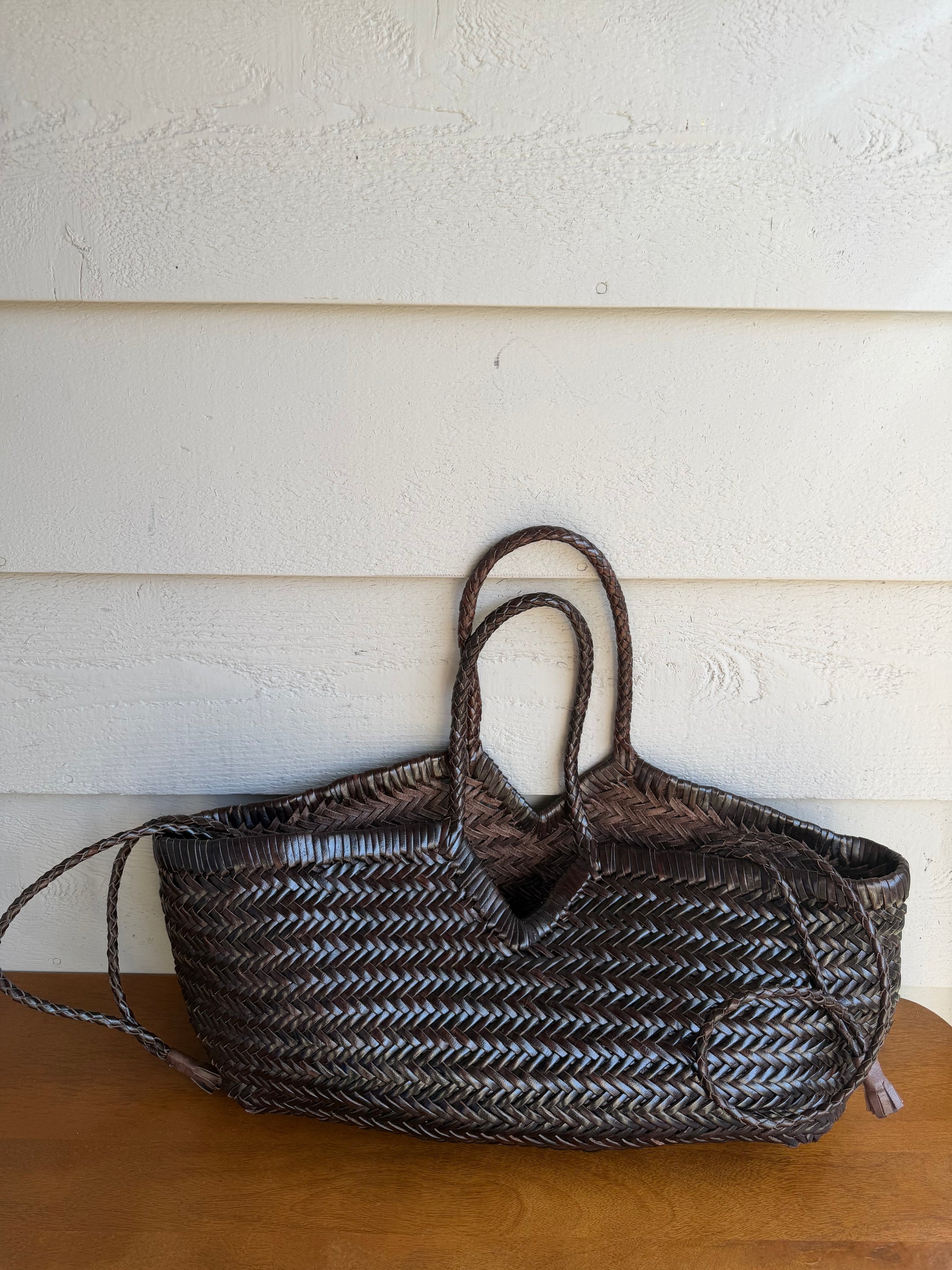 CASSIA handwoven leather bag styled outdoors in natural light