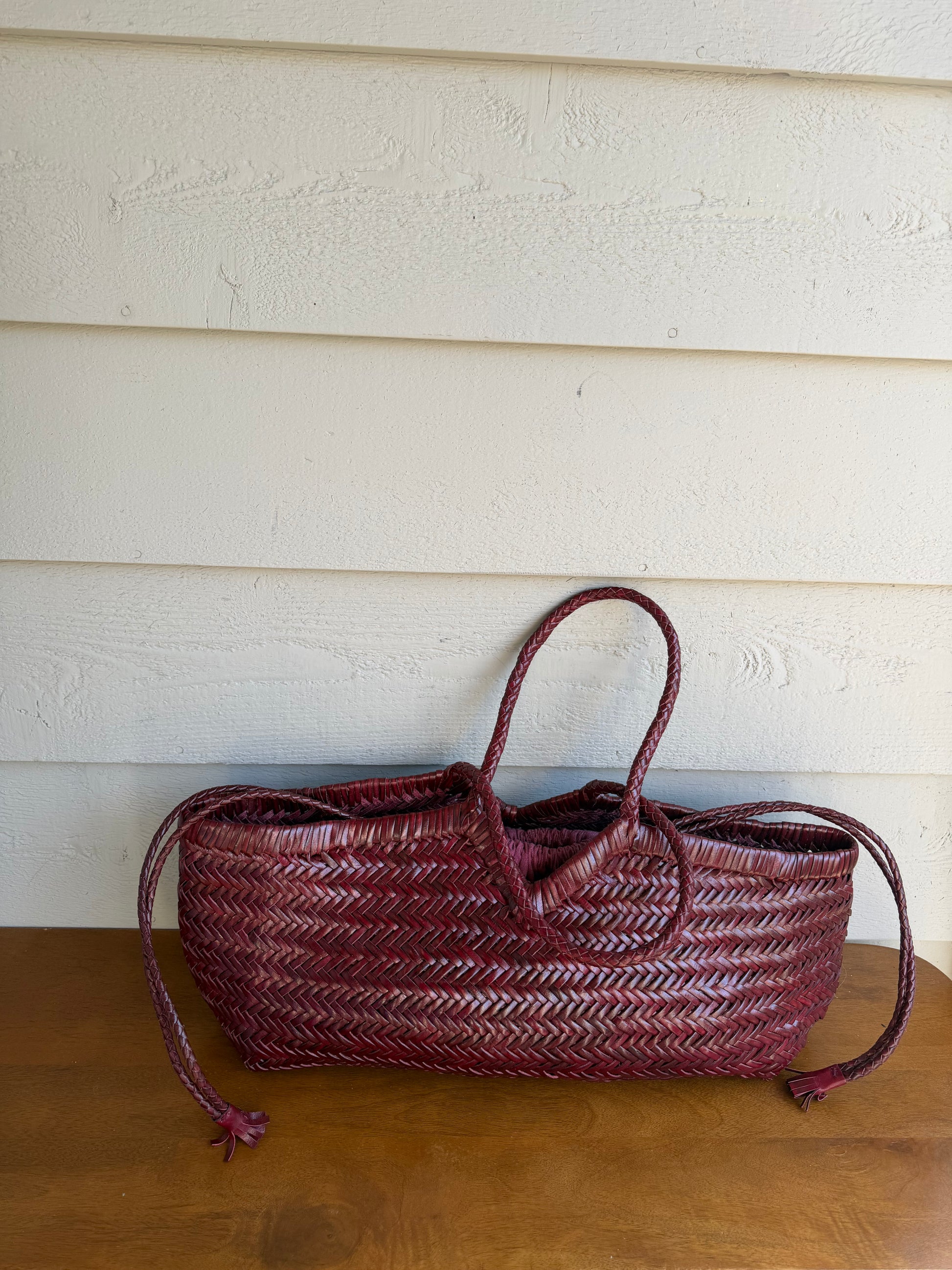 KAPSA handwoven leather bag styled outdoors in natural light