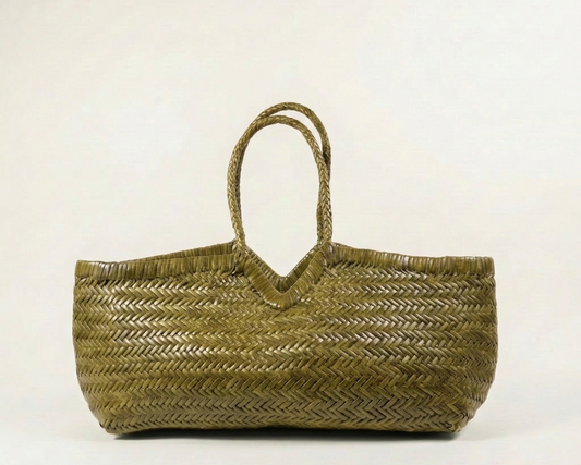 Olive Woven bag on a light beige background